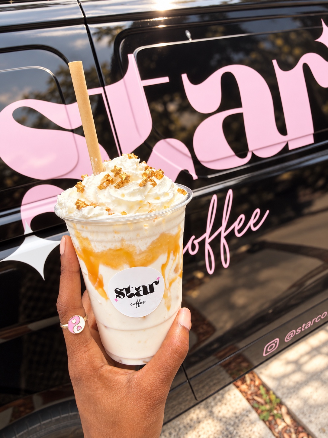 Star Coffee drink with cream and caramel beside the branded van