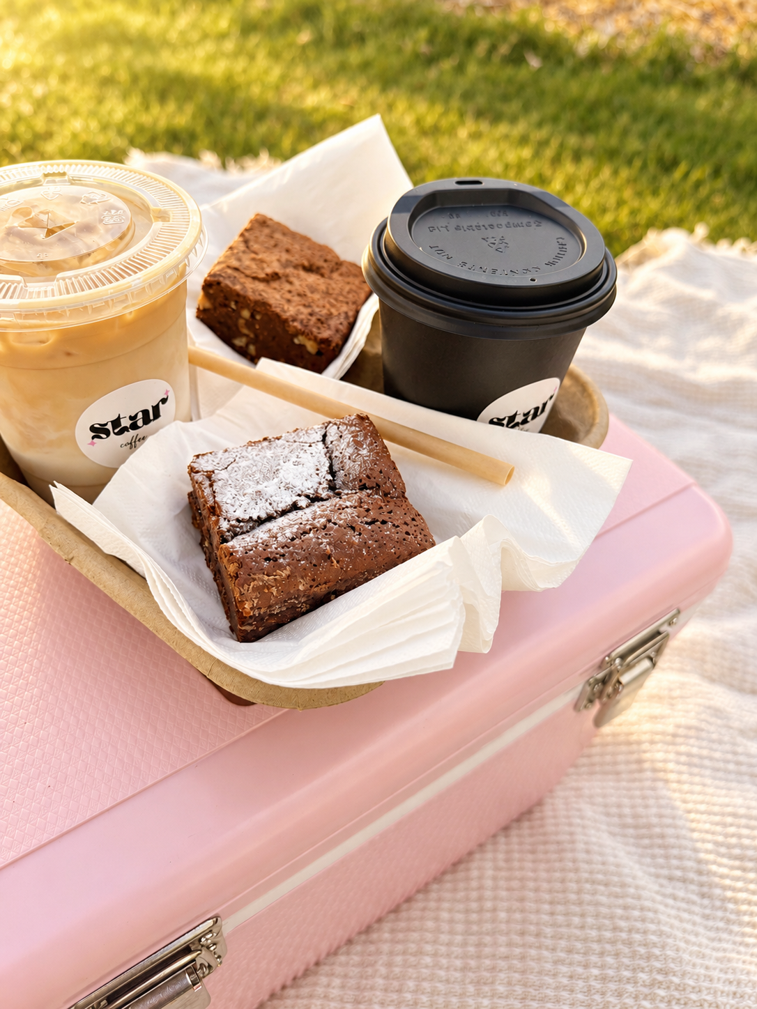 Star Coffee drinks and brownies on a pink case